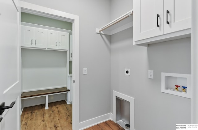 8218 N 167th Ave, Bennington, NE 68007 - washroom with electric dryer hookup, hookup for a washing machine, light wood-style floors, cabinet space, and baseboards