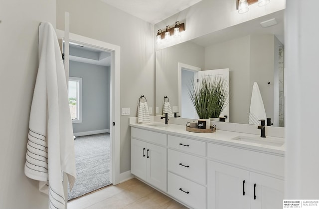 8218 N 167th Ave, Bennington, NE 68007 - bathroom with double vanity and baseboards