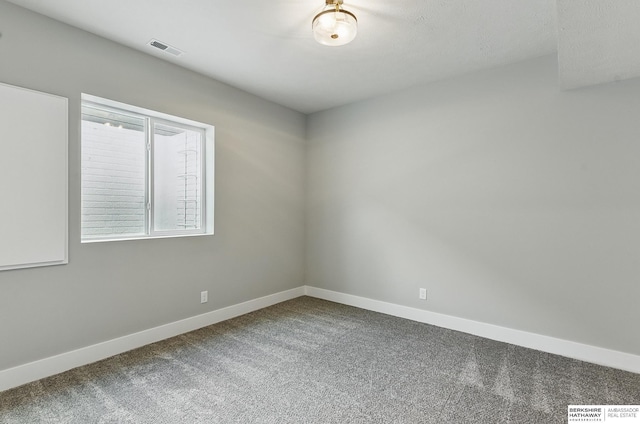 8218 N 167th Ave, Bennington, NE 68007 - empty room featuring carpet floors and baseboards