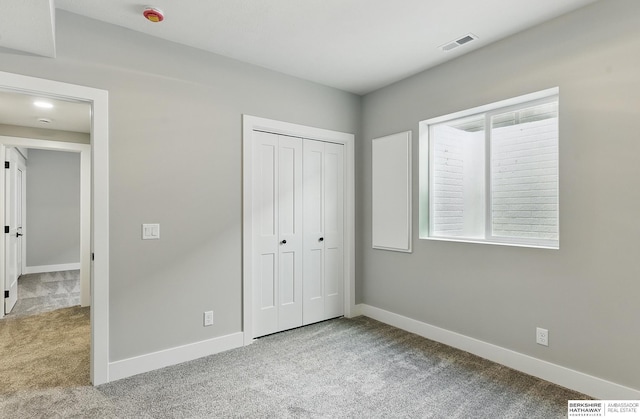 8218 N 167th Ave, Bennington, NE 68007 - unfurnished bedroom with carpet floors, baseboards, and a closet