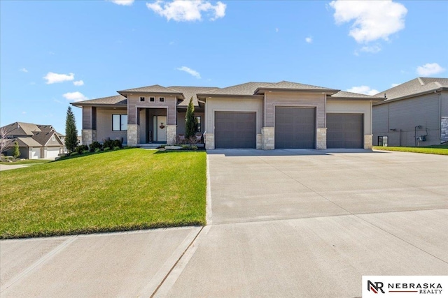12601 S 78th St, Papillion, NE 68046 - prairie-style house featuring a garage, concrete driveway, a front yard, and stone siding