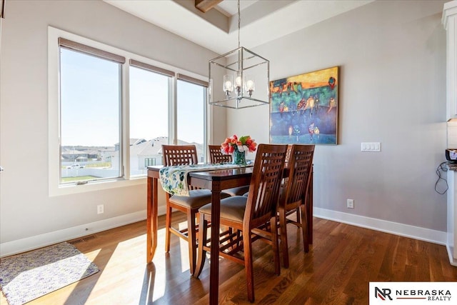 12601 S 78th St, Papillion, NE 68046 - dining area featuring plenty of natural light, a chandelier, baseboards, and wood finished floors