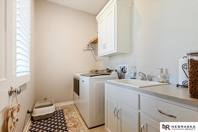 12601 S 78th St, Papillion, NE 68046 - laundry room with cabinet space, washing machine and dryer, and baseboards