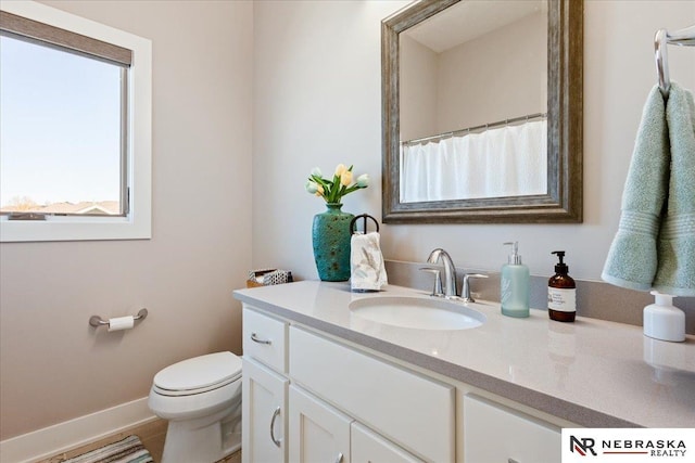 12601 S 78th St, Papillion, NE 68046 - bathroom with vanity, toilet, and baseboards