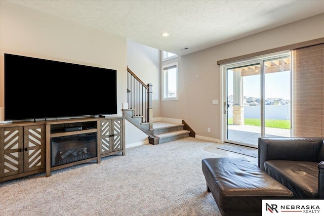 12601 S 78th St, Papillion, NE 68046 - living area featuring carpet flooring, stairway, baseboards, and recessed lighting