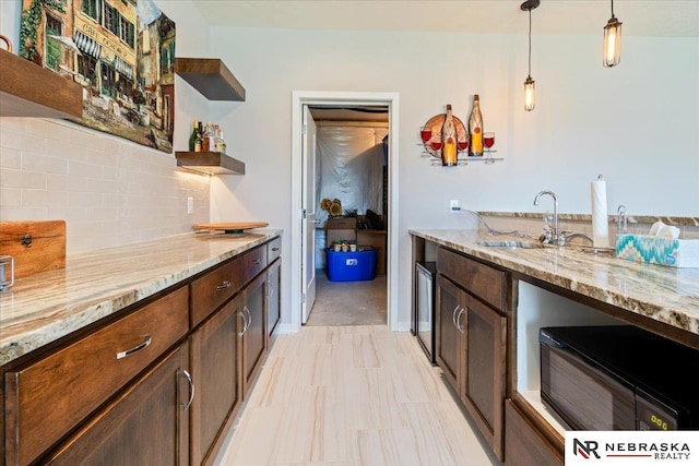 12601 S 78th St, Papillion, NE 68046 - kitchen with open shelves, a sink, tasteful backsplash, decorative light fixtures, and light stone countertops