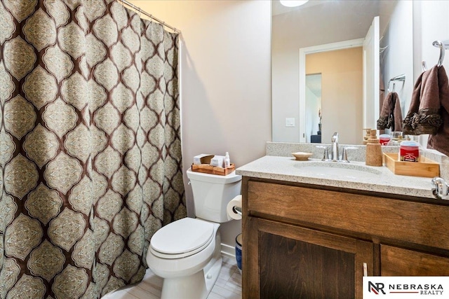 12601 S 78th St, Papillion, NE 68046 - bathroom with vanity, toilet, and curtained shower