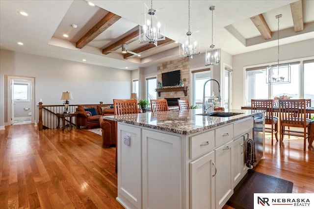 12601 S 78th St, Papillion, NE 68046 - kitchen featuring a sink, a chandelier, beamed ceiling, open floor plan, and stainless steel dishwasher
