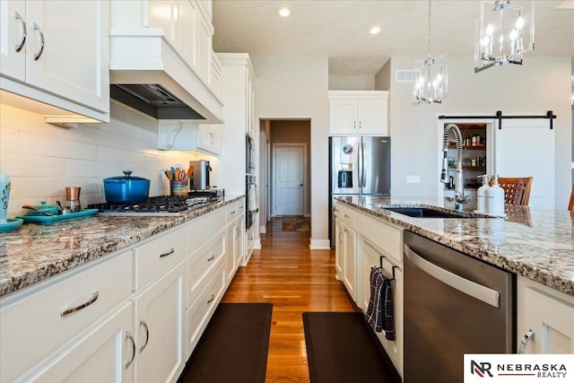 12601 S 78th St, Papillion, NE 68046 - kitchen featuring a sink, stainless steel appliances, a chandelier, custom range hood, and tasteful backsplash