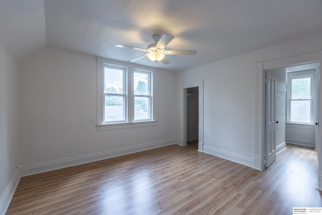 425 W Eagle St, Arlington, NE 68002 - unfurnished bedroom featuring light wood-style floors, baseboards, ceiling fan, and lofted ceiling