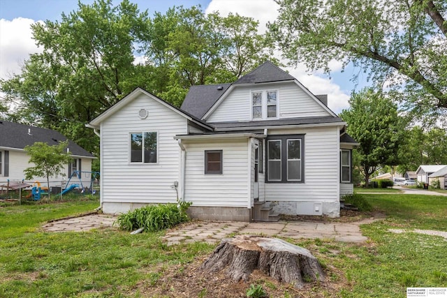 425 W Eagle St, Arlington, NE 68002 - rear view of property with a lawn, entry steps, roof with shingles, and a patio area