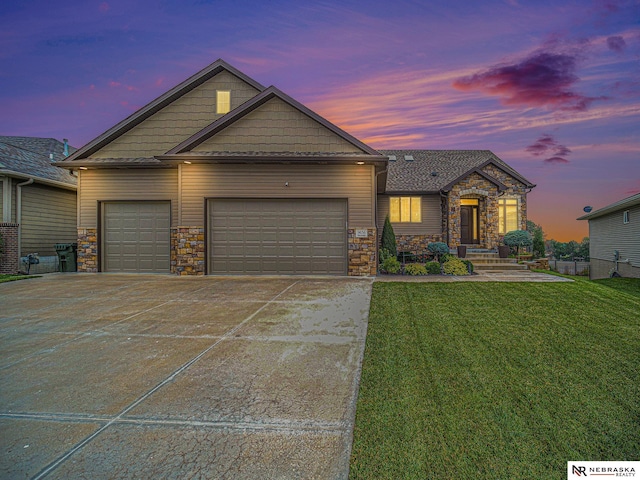 9656 White Pine Rd, Lincoln, NE 68505 - craftsman inspired home with stone siding, an attached garage, a lawn, and concrete driveway