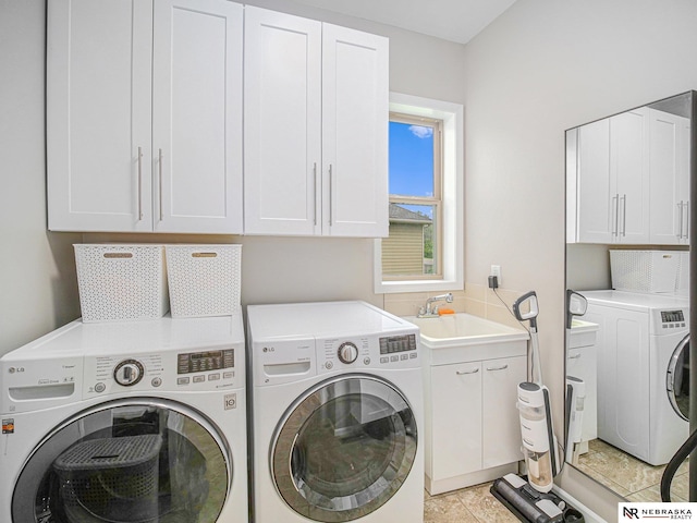 9656 White Pine Rd, Lincoln, NE 68505 - laundry room with washer and dryer and cabinet space