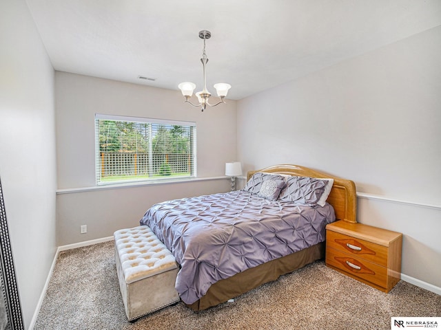 9656 White Pine Rd, Lincoln, NE 68505 - carpeted bedroom with a chandelier and baseboards