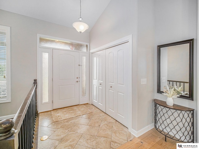 9656 White Pine Rd, Lincoln, NE 68505 - entryway featuring vaulted ceiling and baseboards