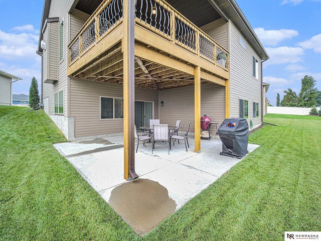 9656 White Pine Rd, Lincoln, NE 68505 - rear view of house featuring a yard, a patio, and a deck