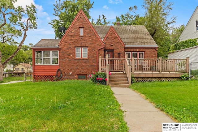 5101 Maple St, Omaha, NE 68104 - tudor home featuring brick siding, a deck, and a chimney