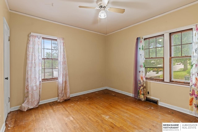 5101 Maple St, Omaha, NE 68104 - empty room with crown molding, hardwood / wood-style flooring, baseboards, and ceiling fan