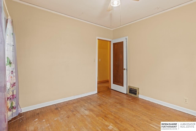 5101 Maple St, Omaha, NE 68104 - unfurnished room featuring wood finished floors, baseboards, crown molding, and ceiling fan