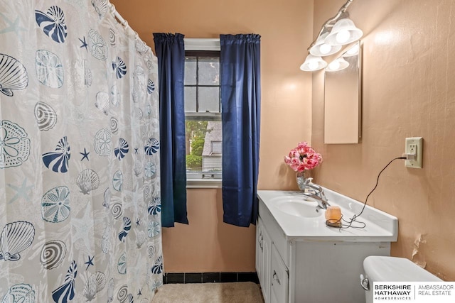 5101 Maple St, Omaha, NE 68104 - bathroom with vanity, toilet, a shower with curtain, and baseboards