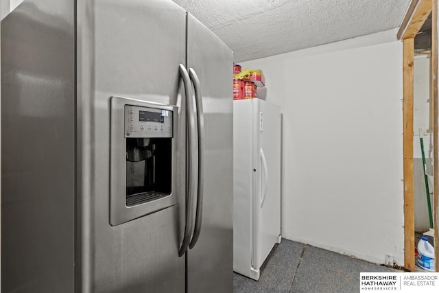 5101 Maple St, Omaha, NE 68104 - kitchen featuring stainless steel fridge with ice dispenser, freestanding refrigerator, and a textured ceiling