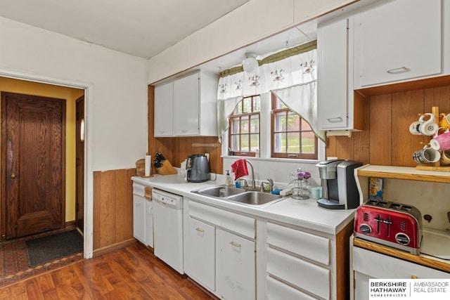 5101 Maple St, Omaha, NE 68104 - kitchen featuring dishwasher, a sink, light countertops, wooden walls, and white cabinets