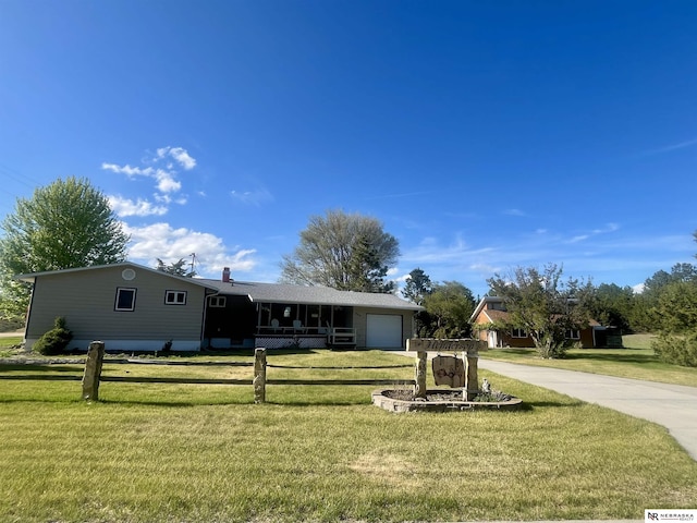 606 E 7th St, Valentine, NE 69201 - ranch-style home with an attached garage, driveway, and a porch