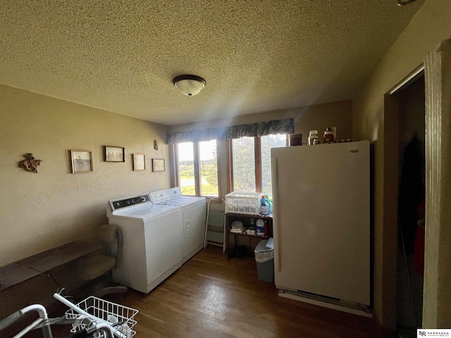 606 E 7th St, Valentine, NE 69201 - washroom with separate washer and dryer, a textured ceiling, and wood finished floors