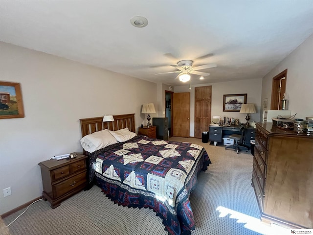 606 E 7th St, Valentine, NE 69201 - bedroom featuring light colored carpet, a ceiling fan, baseboards, and an office area
