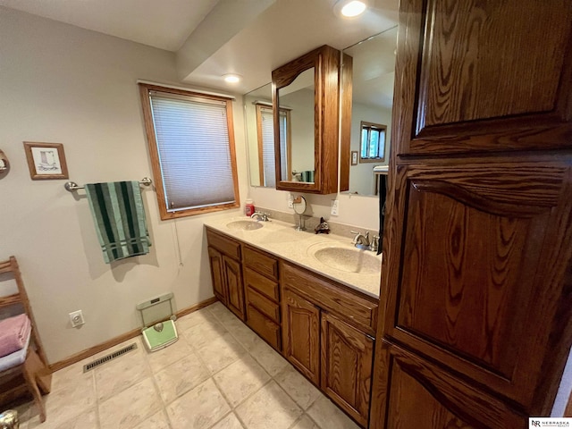 606 E 7th St, Valentine, NE 69201 - full bathroom with double vanity and baseboards