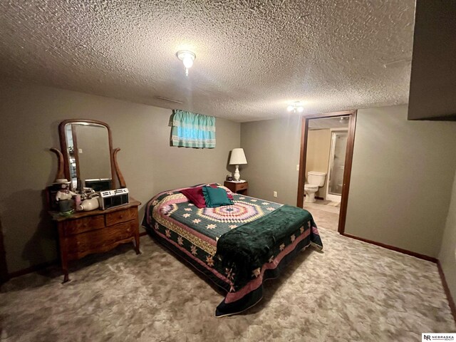 606 E 7th St, Valentine, NE 69201 - carpeted bedroom with a textured ceiling and ensuite bathroom