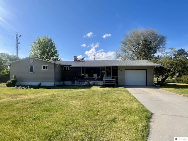606 E 7th St, Valentine, NE 69201 - ranch-style home with a garage, driveway, a front lawn, covered porch, and a chimney