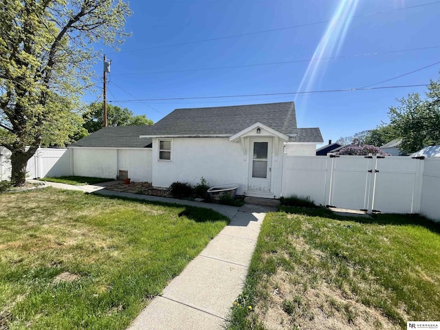 238 N Ray St, Valentine, NE 69201 - bungalow with a shingled roof, a gate, and stucco siding