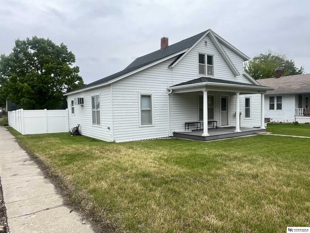 238 N Ray St, Valentine, NE 69201 - back of house featuring covered porch, a chimney, and a shingled roof