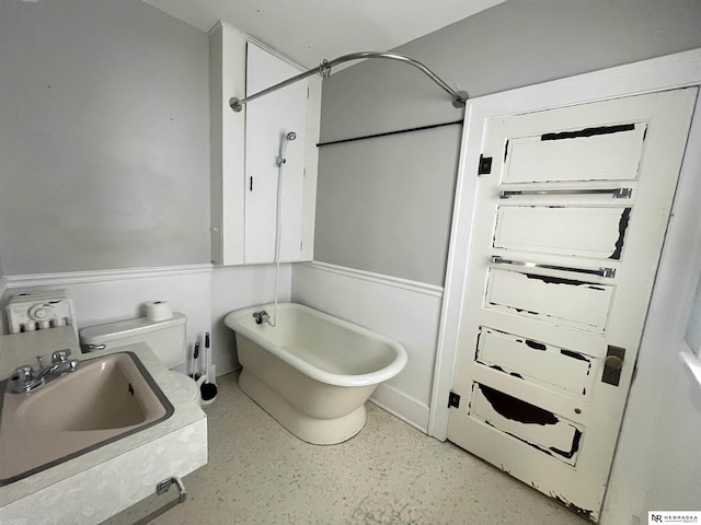 238 N Ray St, Valentine, NE 69201 - bathroom featuring a freestanding bath, a sink, and a shower