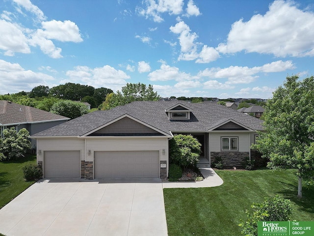 7968 N 163rd Ave, Bennington, NE 68007 - view of front of house featuring a garage, stone siding, a front lawn, and driveway