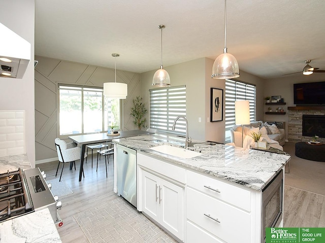 7968 N 163rd Ave, Bennington, NE 68007 - kitchen featuring a sink, stainless steel appliances, light wood finished floors, and plenty of natural light