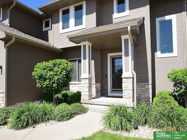 7968 N 163rd Ave, Bennington, NE 68007 - view of exterior entry with covered porch and stone siding