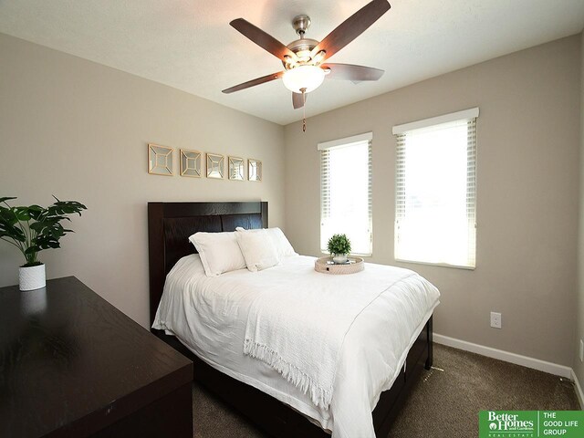 7968 N 163rd Ave, Bennington, NE 68007 - bedroom featuring baseboards, dark colored carpet, and ceiling fan