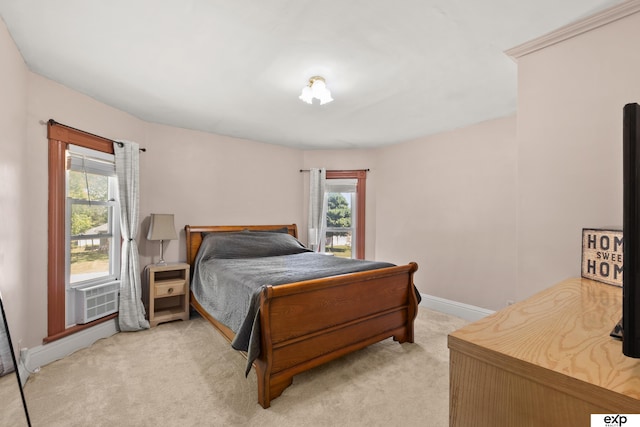 1346 G St, Pawnee City, NE 68420 - bedroom with light colored carpet, baseboards, and cooling unit