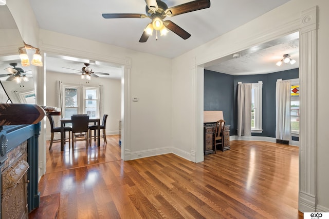 1346 G St, Pawnee City, NE 68420 - dining space featuring a ceiling fan, wood finished floors, and baseboards