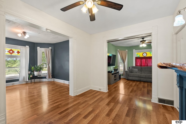 1346 G St, Pawnee City, NE 68420 - living area featuring a ceiling fan, wood finished floors, and baseboards