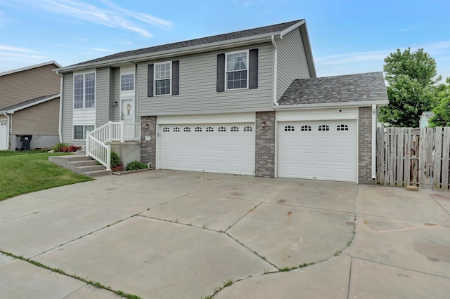 4441 W Hub Hall Dr, Lincoln, NE 68528 - view of front facade with concrete driveway, brick siding, and an attached garage