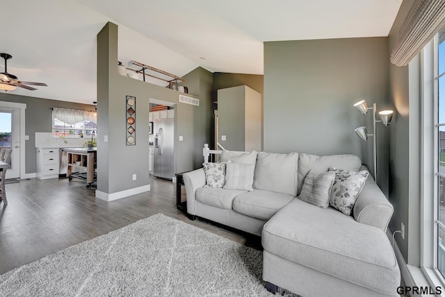 4441 W Hub Hall Dr, Lincoln, NE 68528 - living area with ceiling fan, wood finished floors, vaulted ceiling, and baseboards
