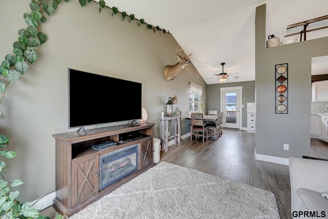 4441 W Hub Hall Dr, Lincoln, NE 68528 - living area with wood finished floors, baseboards, a ceiling fan, and vaulted ceiling