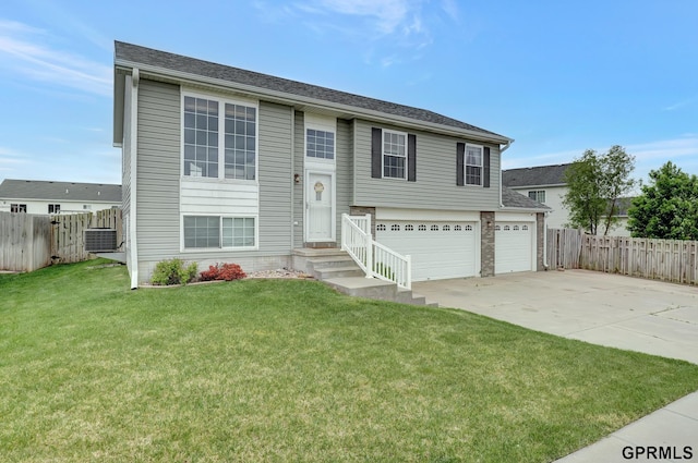 4441 W Hub Hall Dr, Lincoln, NE 68528 - raised ranch with concrete driveway, an attached garage, and central air condition unit
