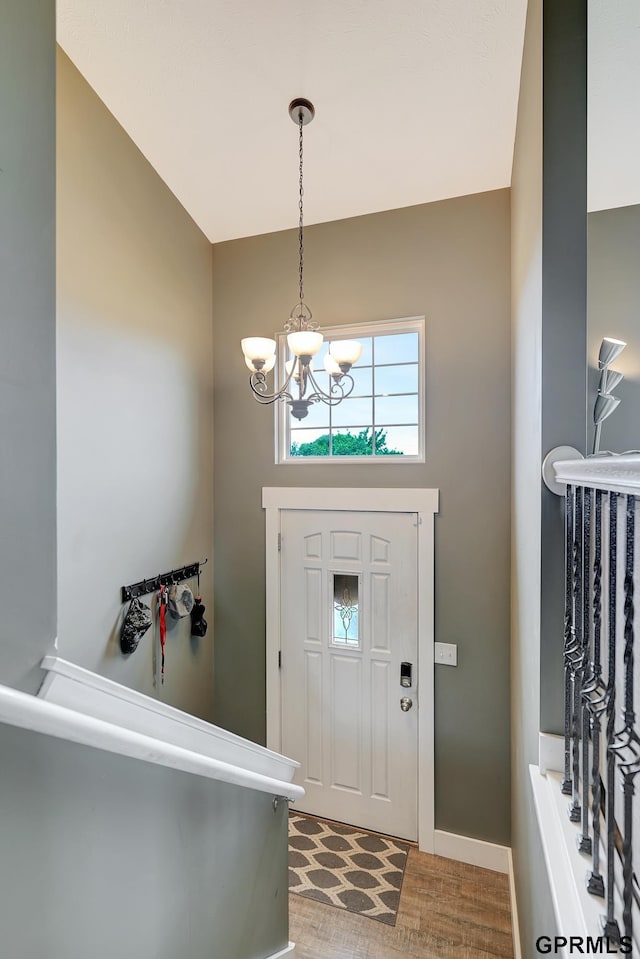 4441 W Hub Hall Dr, Lincoln, NE 68528 - entrance foyer featuring a chandelier, baseboards, and wood finished floors