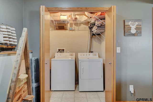 4441 W Hub Hall Dr, Lincoln, NE 68528 - laundry area featuring independent washer and dryer and tile patterned flooring