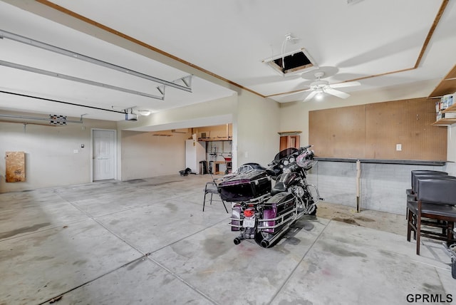 4441 W Hub Hall Dr, Lincoln, NE 68528 - garage featuring a garage door opener and ceiling fan