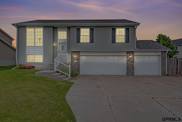 4441 W Hub Hall Dr, Lincoln, NE 68528 - view of front of property with concrete driveway, brick siding, and a garage